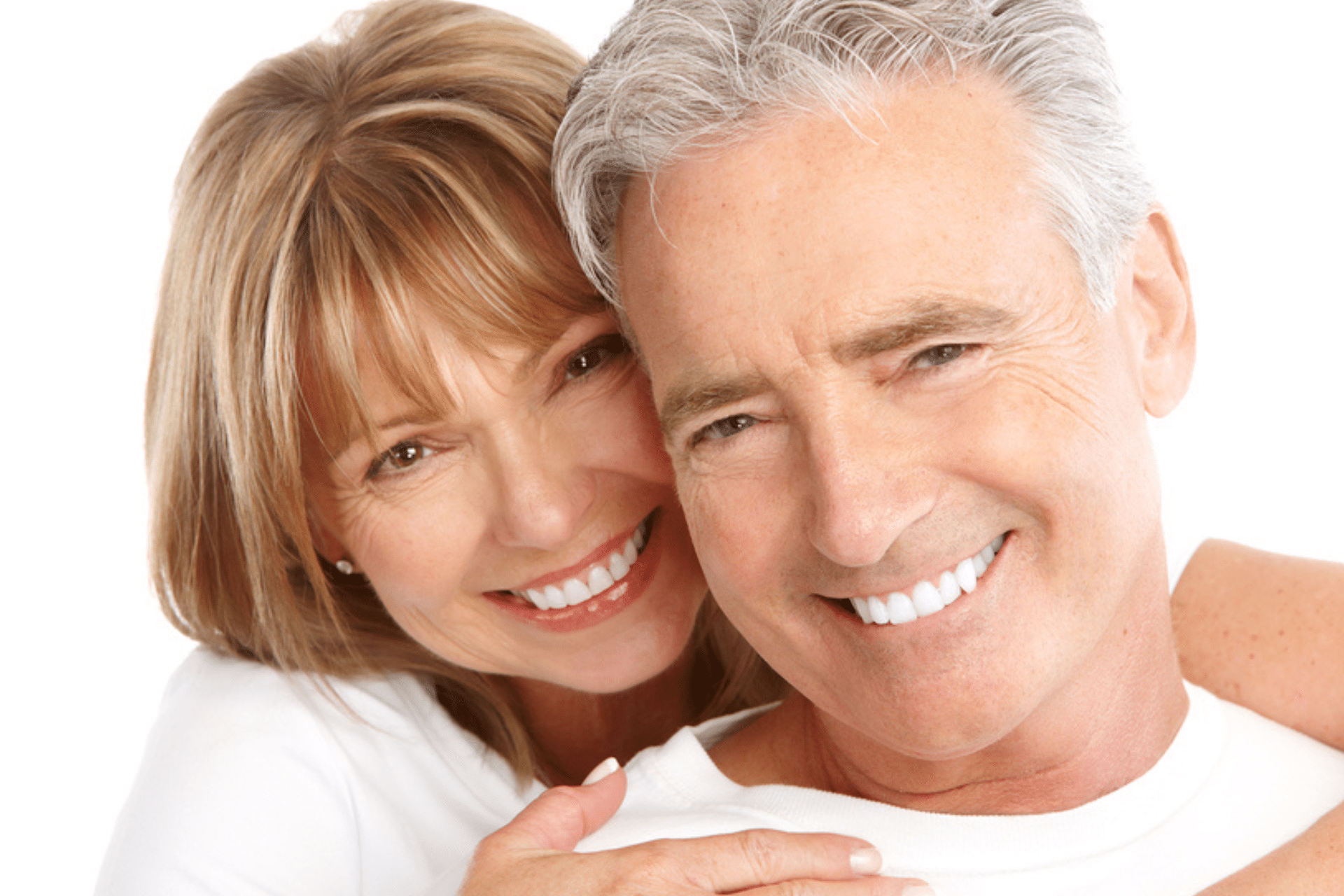Mature man and woman smiling brightly with straight white teeth